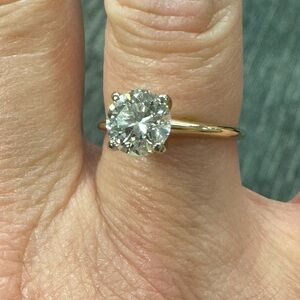1.61 carat diamond engagement ring in 14 k gold setting.
